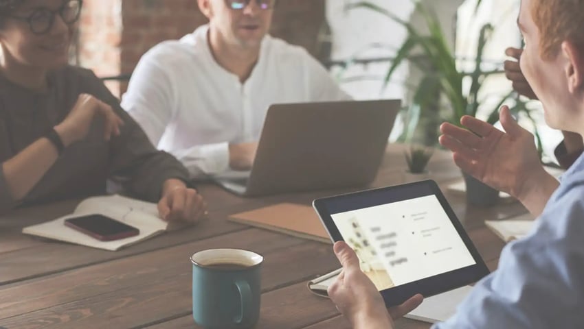 Insurance agents discussing how to successfully grow your agency in 2025