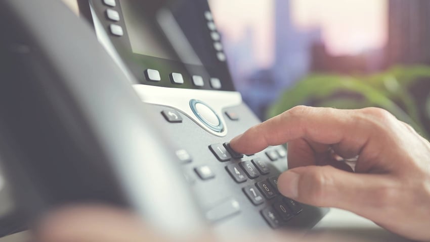 Person hand using telephone to get live transfer leads for insurance agents - really the best leads? | EverQuote Pro