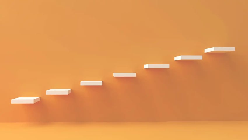 Perfect your follow-up process with these 6 steps - ascending stairs next to a yellow wall