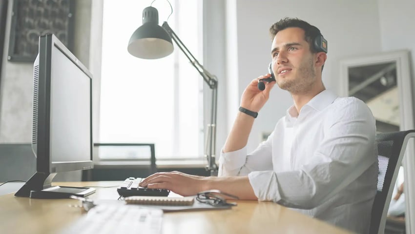 An insurance agent speaking over the phone - warm transfer insurance leads vs. consumer-initiated inbound calls