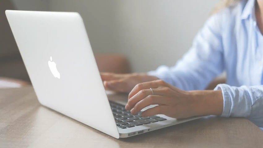 Insurance agent researching what is the most profitable insurance to sell on modern laptop